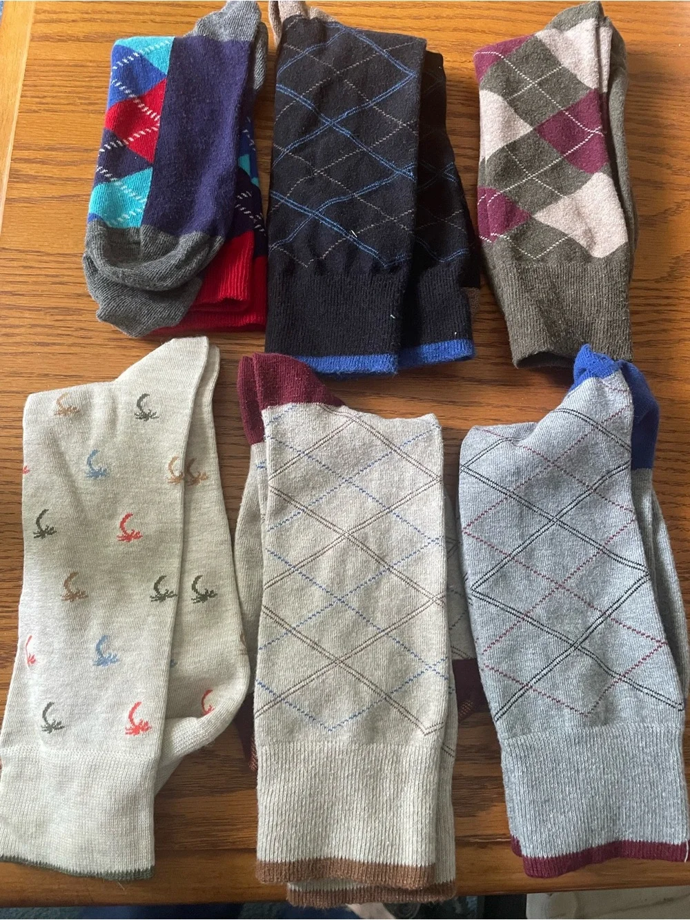 Six pairs socks, including some argyle & one tropical pattern
